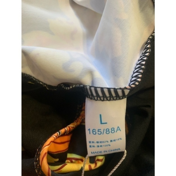 Orange, Yellow and black one piece low V cut Swim suit size Large - Picture 10 of 11